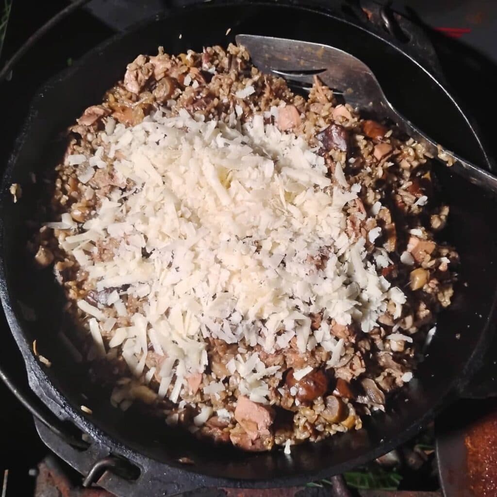 Parmesan was added to the mushroom risotto and will be getting mixed in.