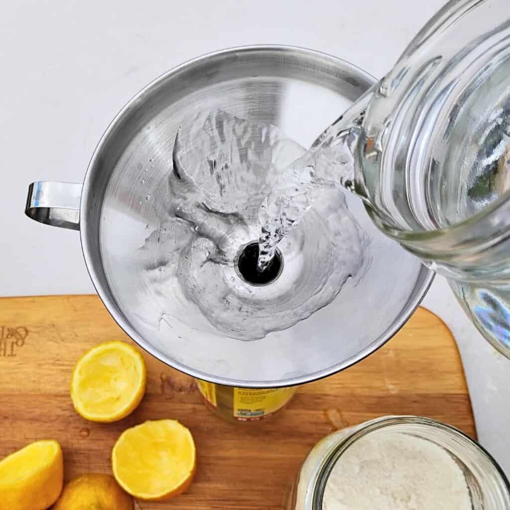 filling the bottle with water.