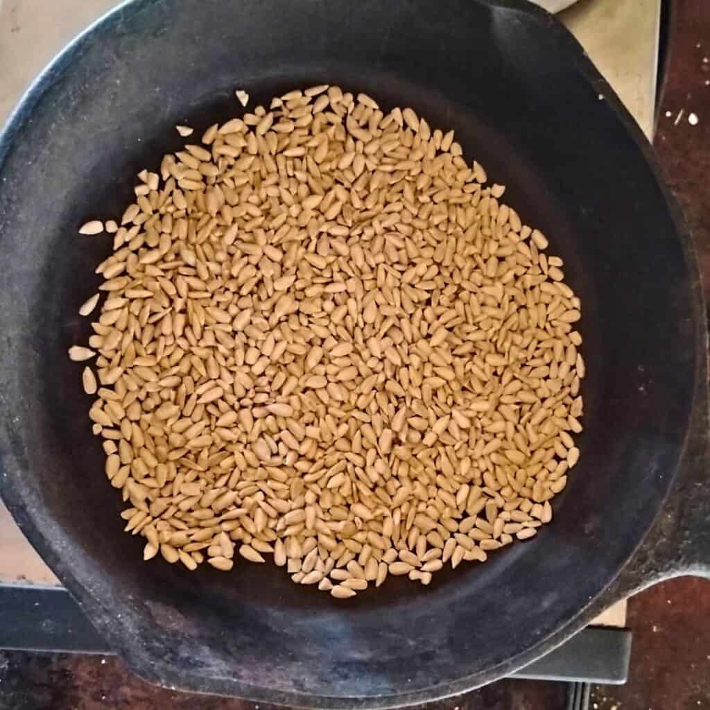 sunflower seeds in a frying pan