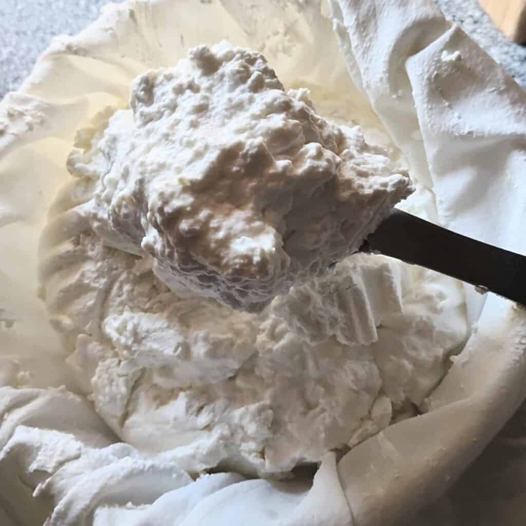 quark cheese curds on a spoon, ready to be used.