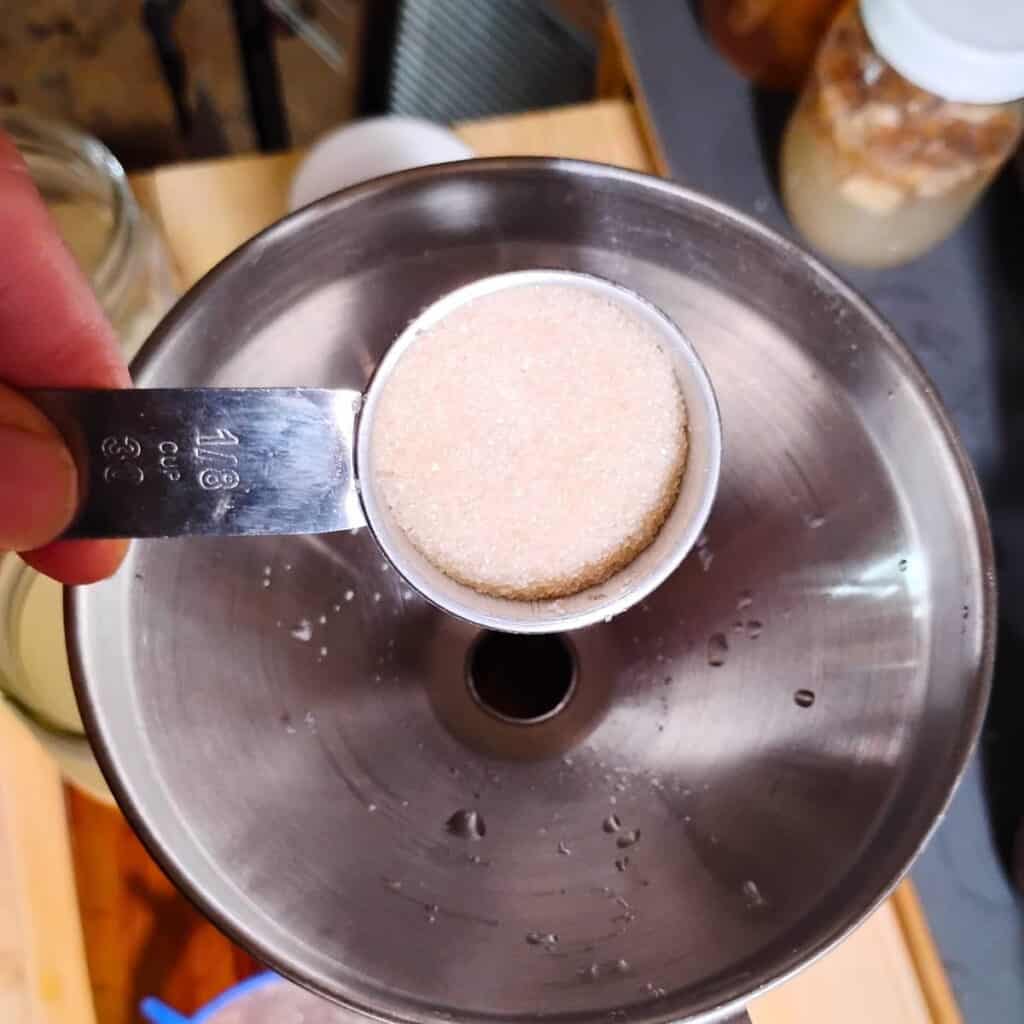 adding sugar to the bottle