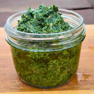 jar full of foraged wild greens pesto.
