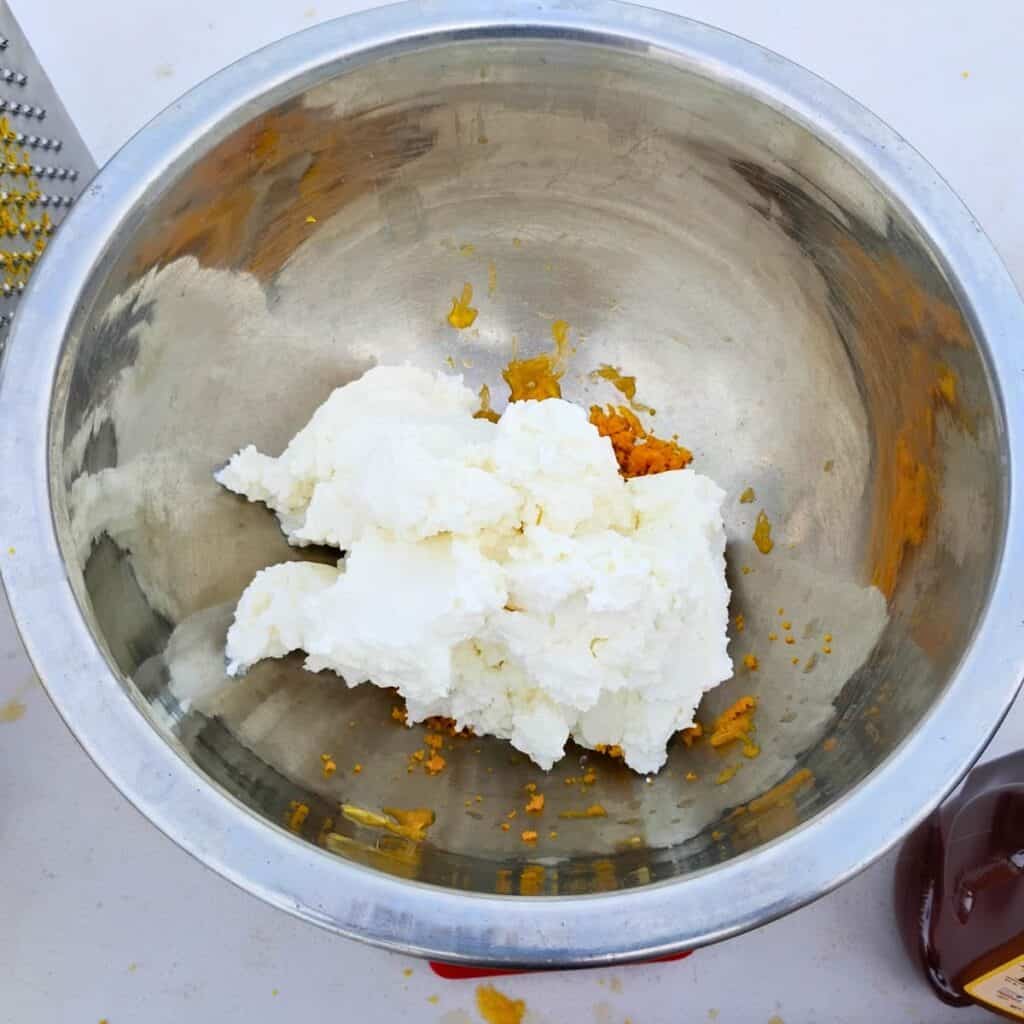 bowl that has quark cheese and orange zest added to it.