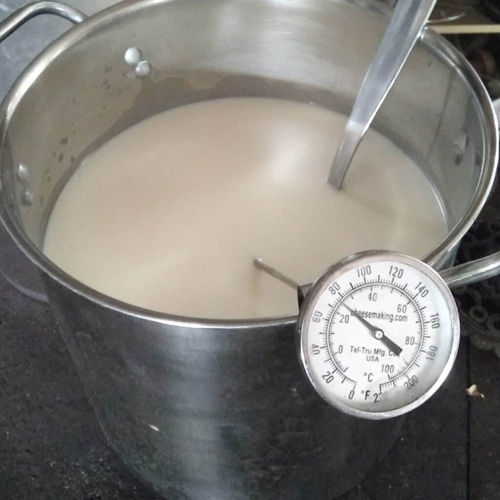 pot full of milk is heated to 80 degrees.