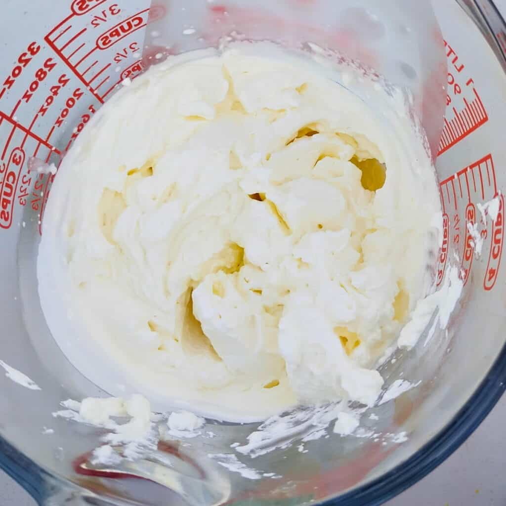 whipping cream whipped up in a glass jar.