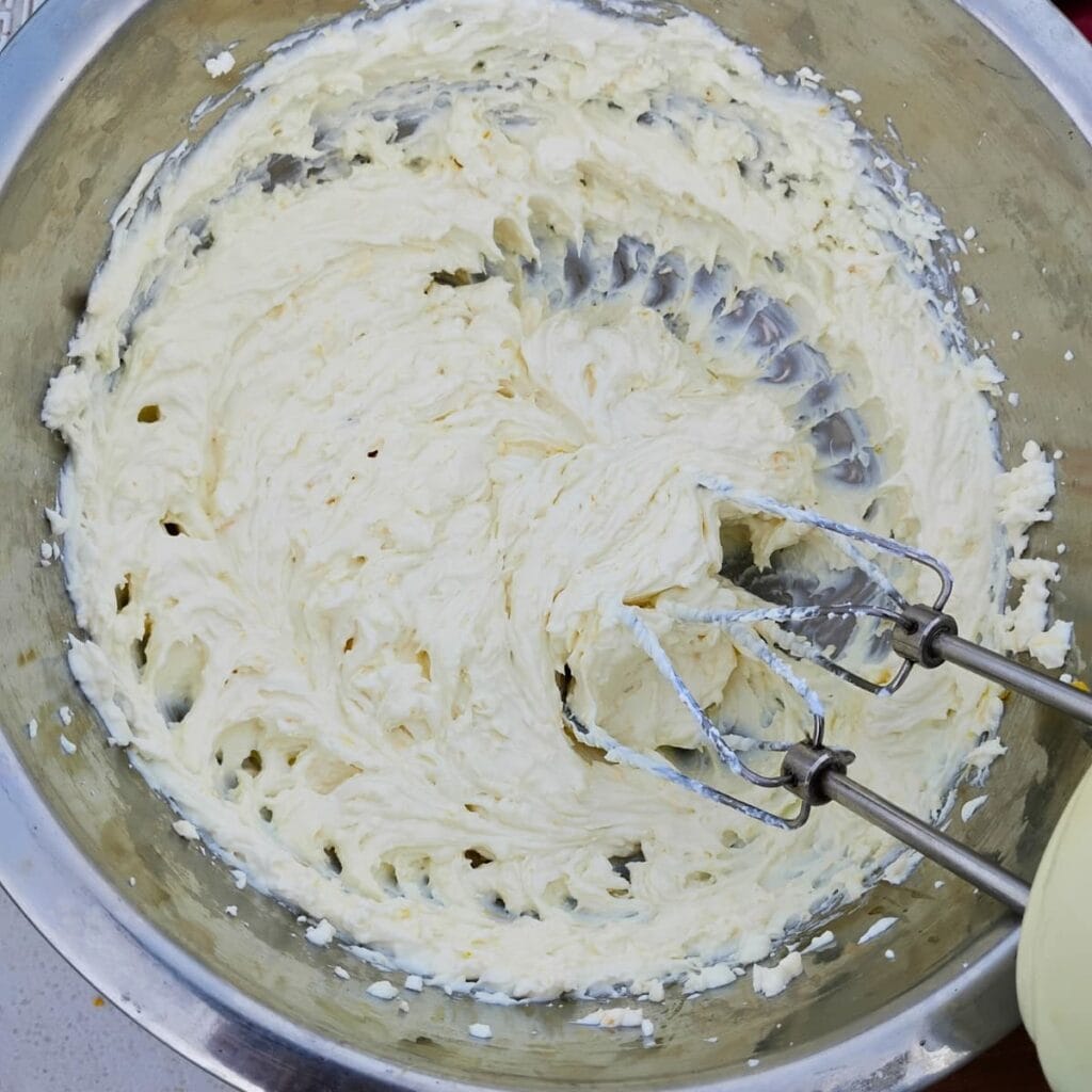 bowl with whipped quark cheese and orange zest.