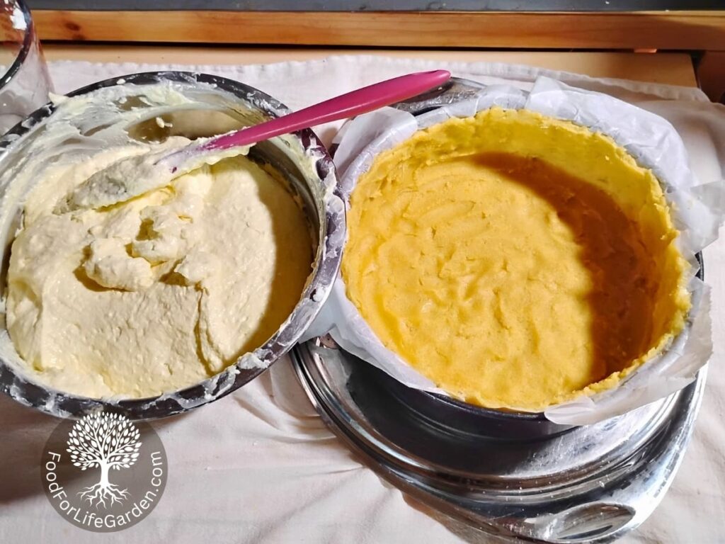 photo of a bowl full of the quark cheese cake batter and an empty shortbread crust shell in a cake form beside it.