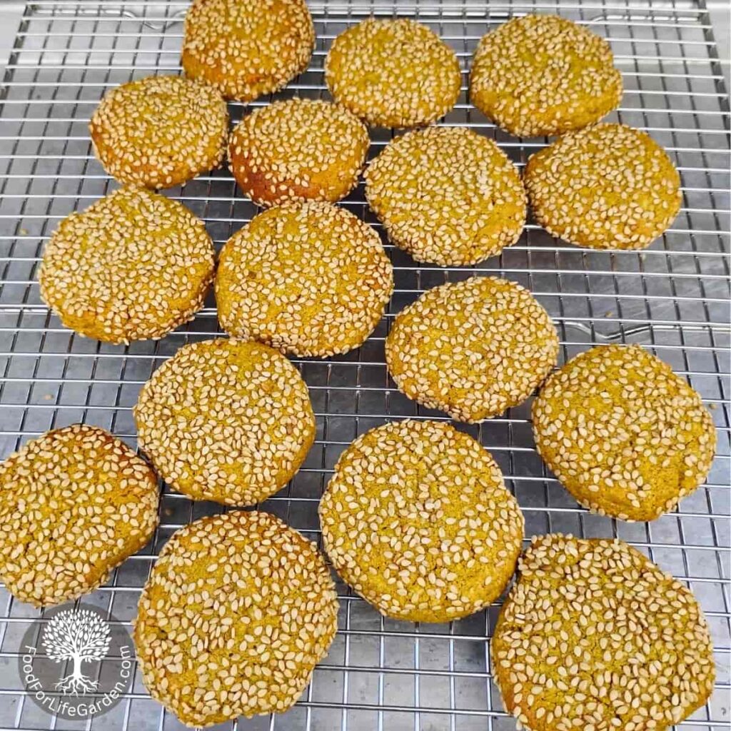 lemon sesame tahini spice cookies cooling down on a cooling rack.