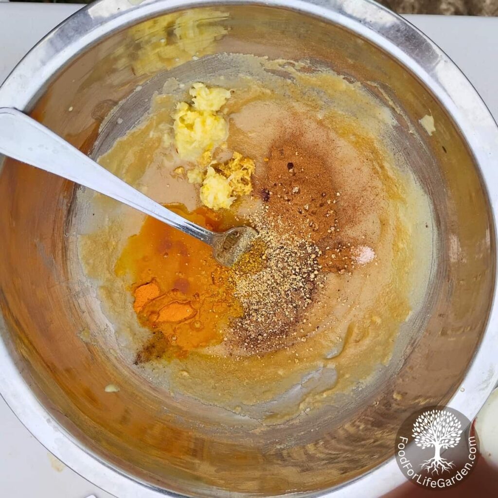 bowl with blended tahini paste and honey and a mix of spices to be incorporated.