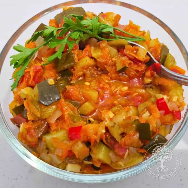 Photo shows a bowl filled with zucchini ikra, a vegetable spread