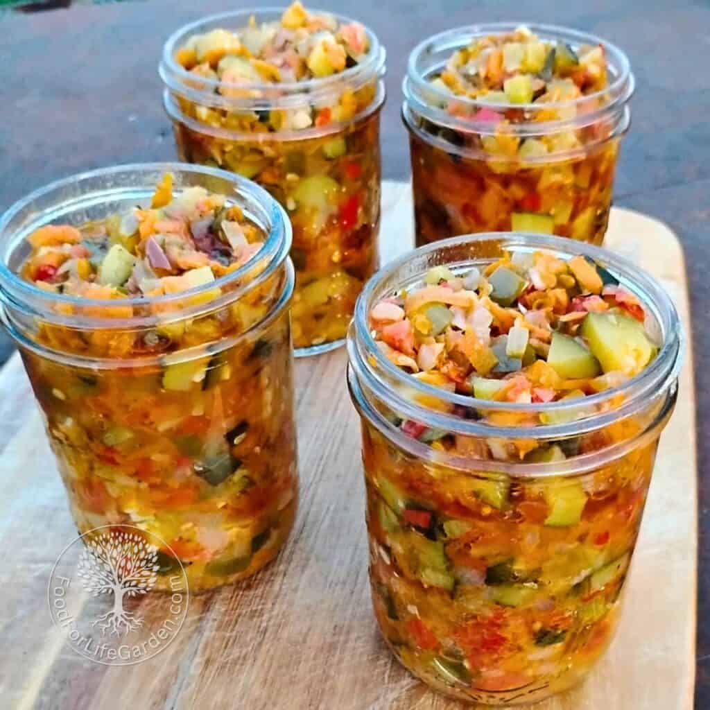 four pint jars filled with zucchini ikra vegetable spread