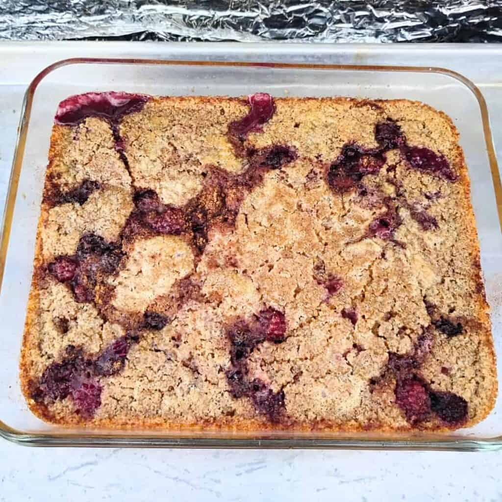 photo of a finished blackberry cobbler in a dish 