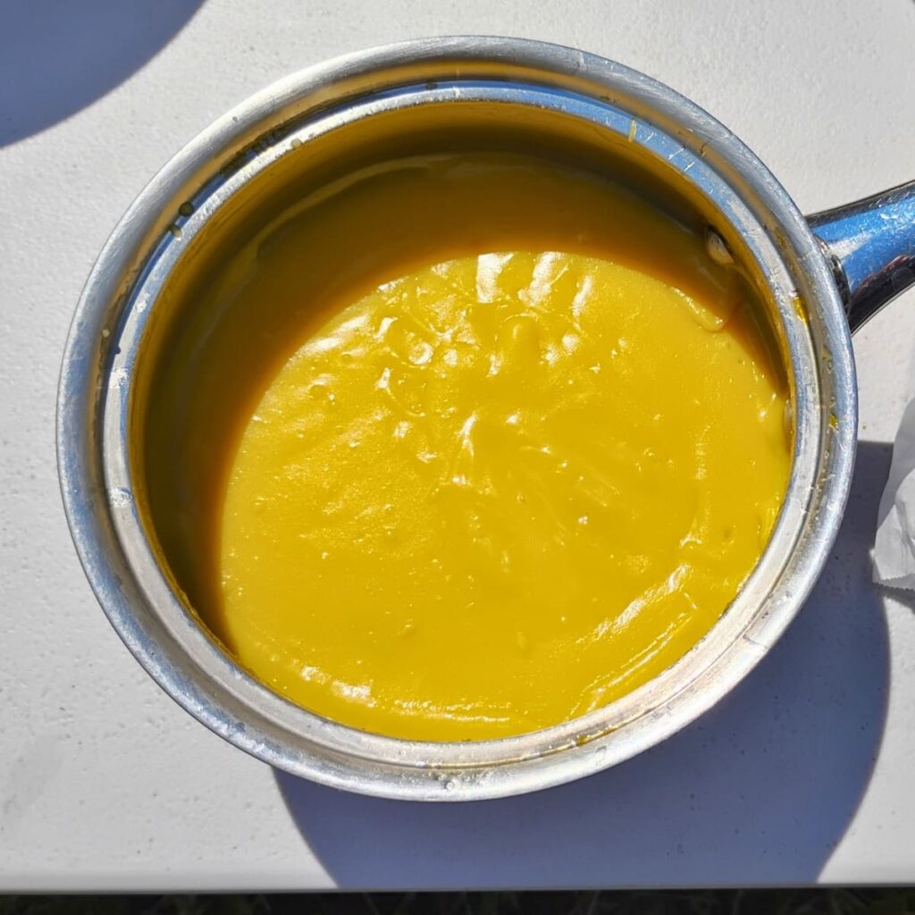 pot filled with fresh made lemon curd 