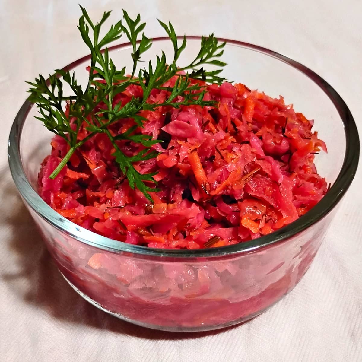 bowl filled with fermented coleslaw with root vegetables, also called garden-slaw
