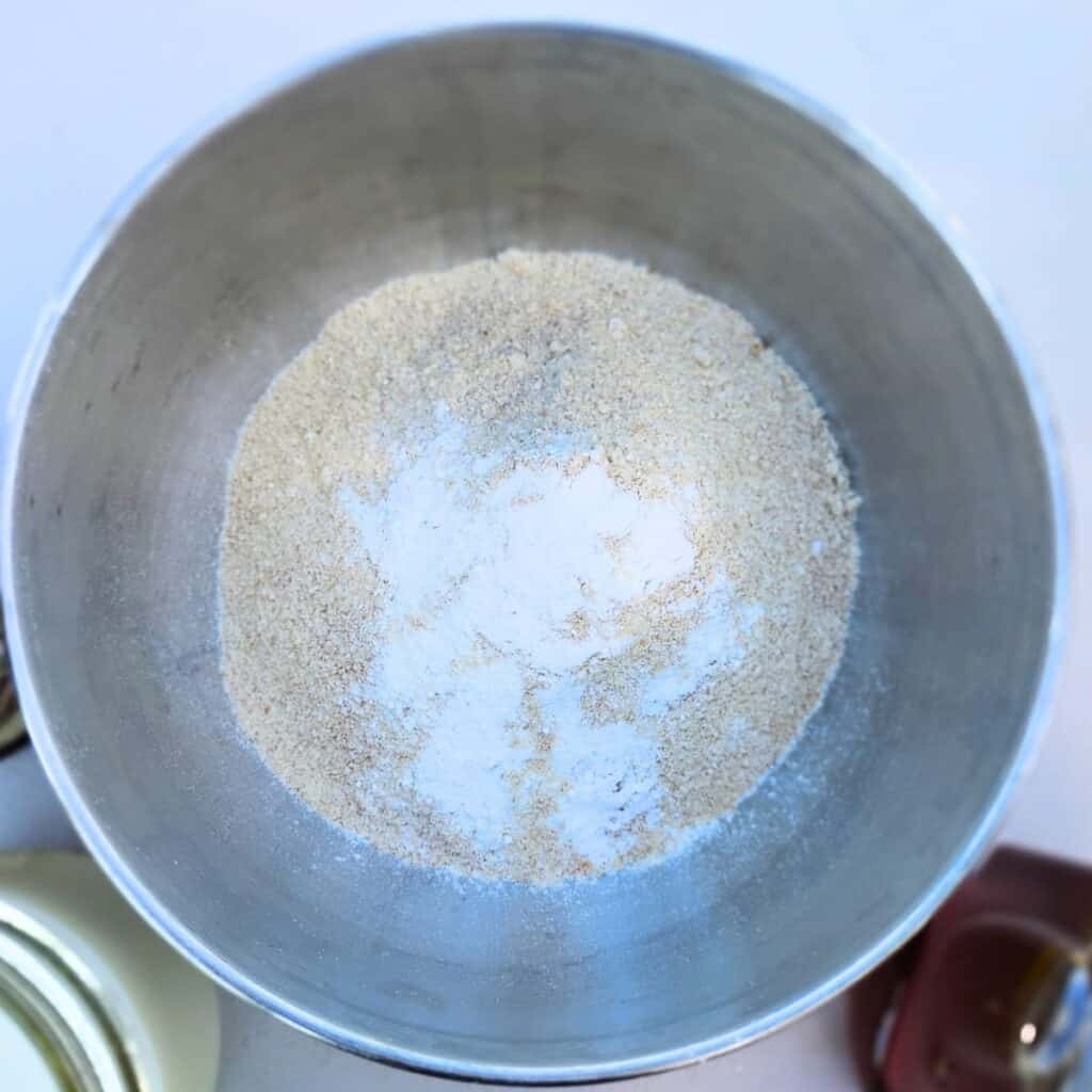 a bowl with some flour and baking powder.