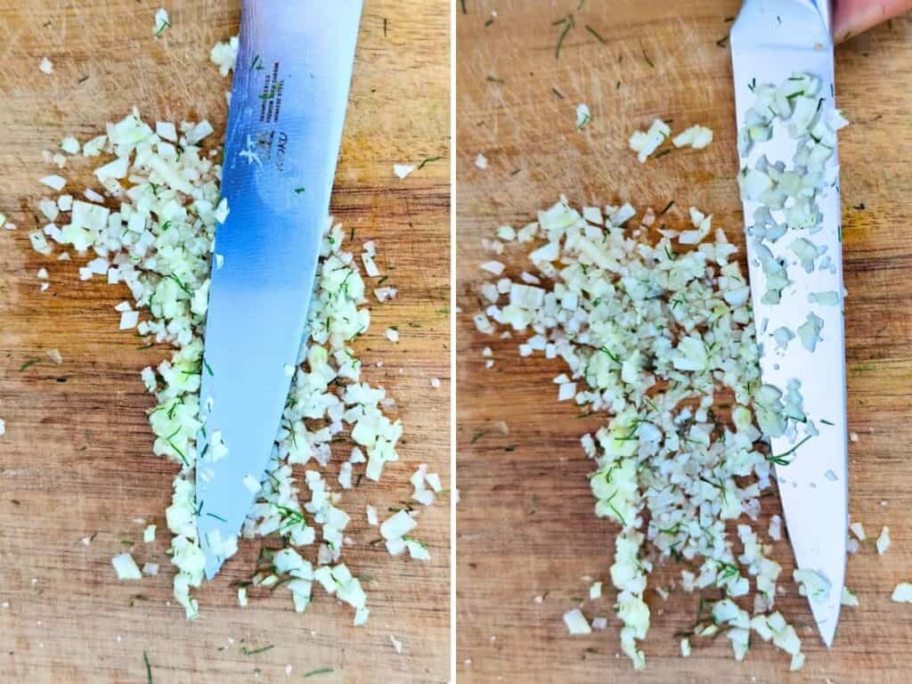 Demonstration of garlic getting mashed with the back of a knife.