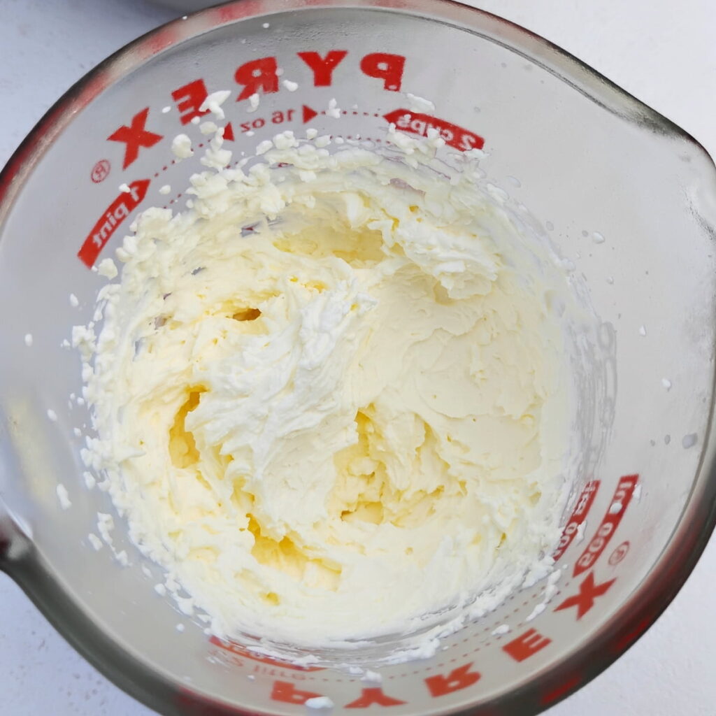 measuring jar with whipped cream