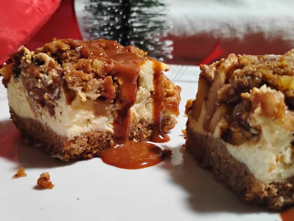 Christmas holiday setting for caramel apple pie cheesecake bars on a plate.