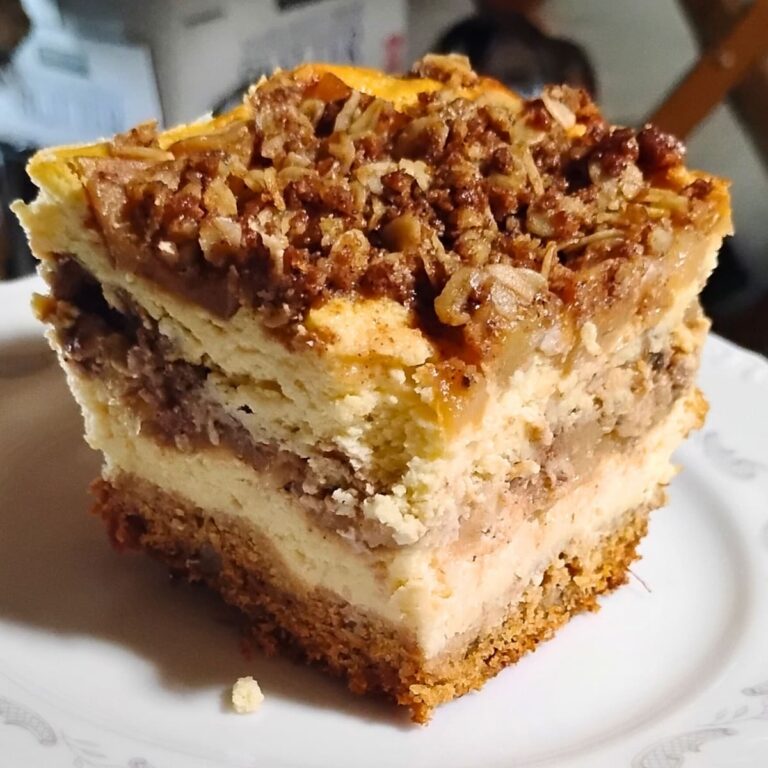 photo shows a layered apple pie cheesecake portion