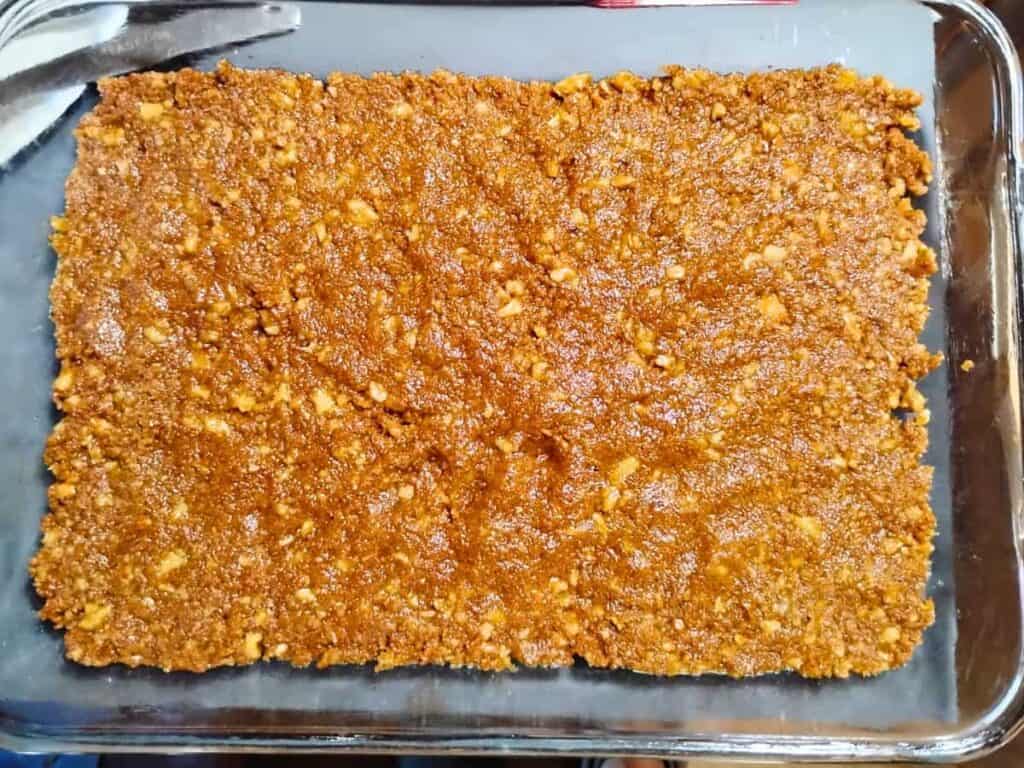 piecrust pressed into a large baking pan.