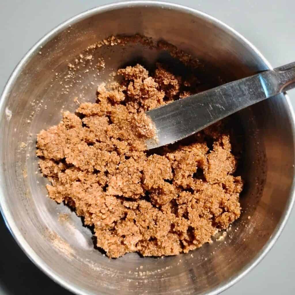 crumbles to be placed on the cake as a topping with a knife in it.