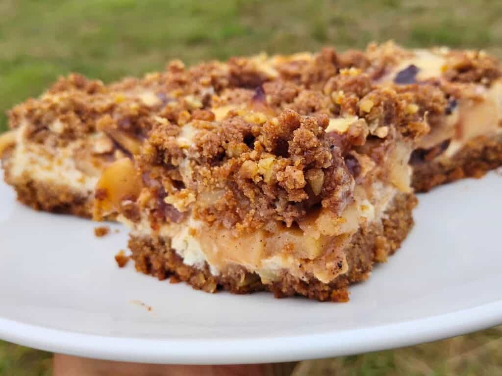 plate with apple pie cheesecake bars