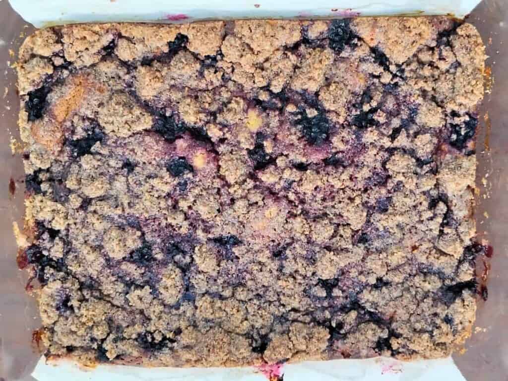 whole blackberry cheesecake with crumbles if finished and out of the oven.