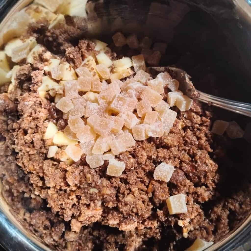 crystallized ginger chunks are added to the sugar, butter, flour and pecan mix.