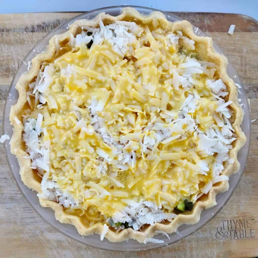 photo of a jalapeno pie that's done assembling with some eggs poured over it.