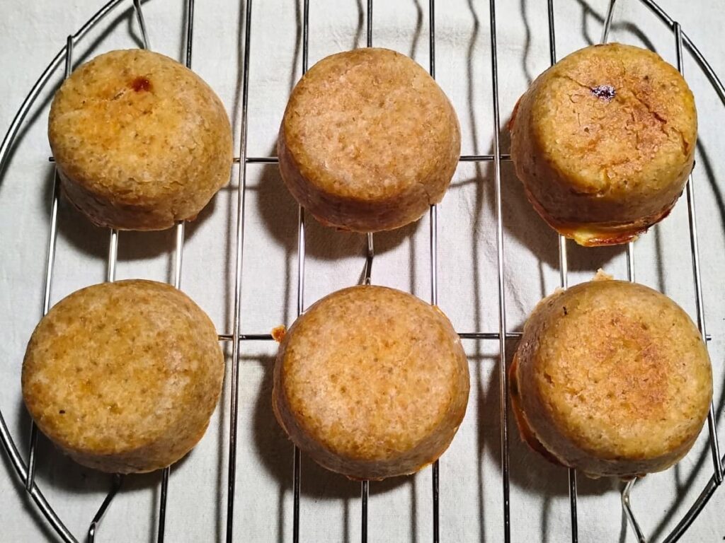 upside down mini quiches on a cooling rack.