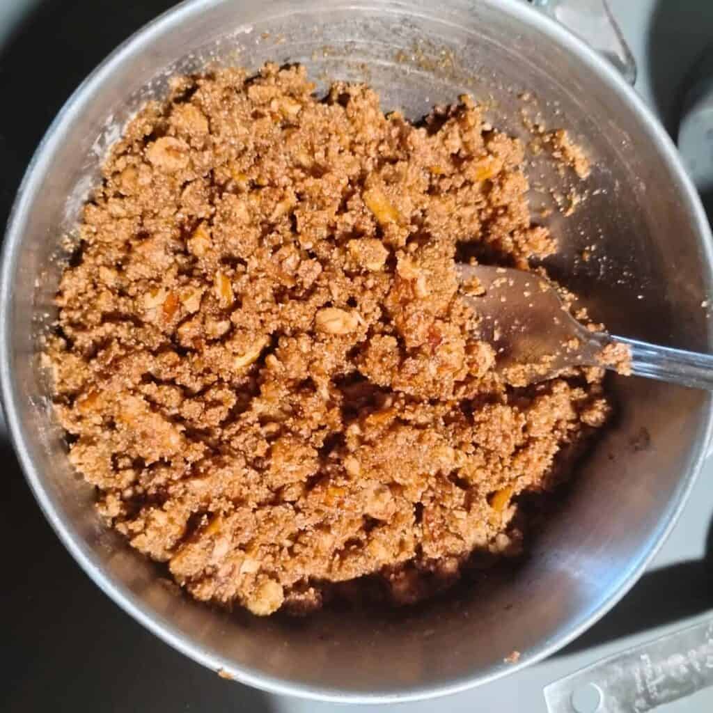 flour, butter, sugar, and pecans are blended together