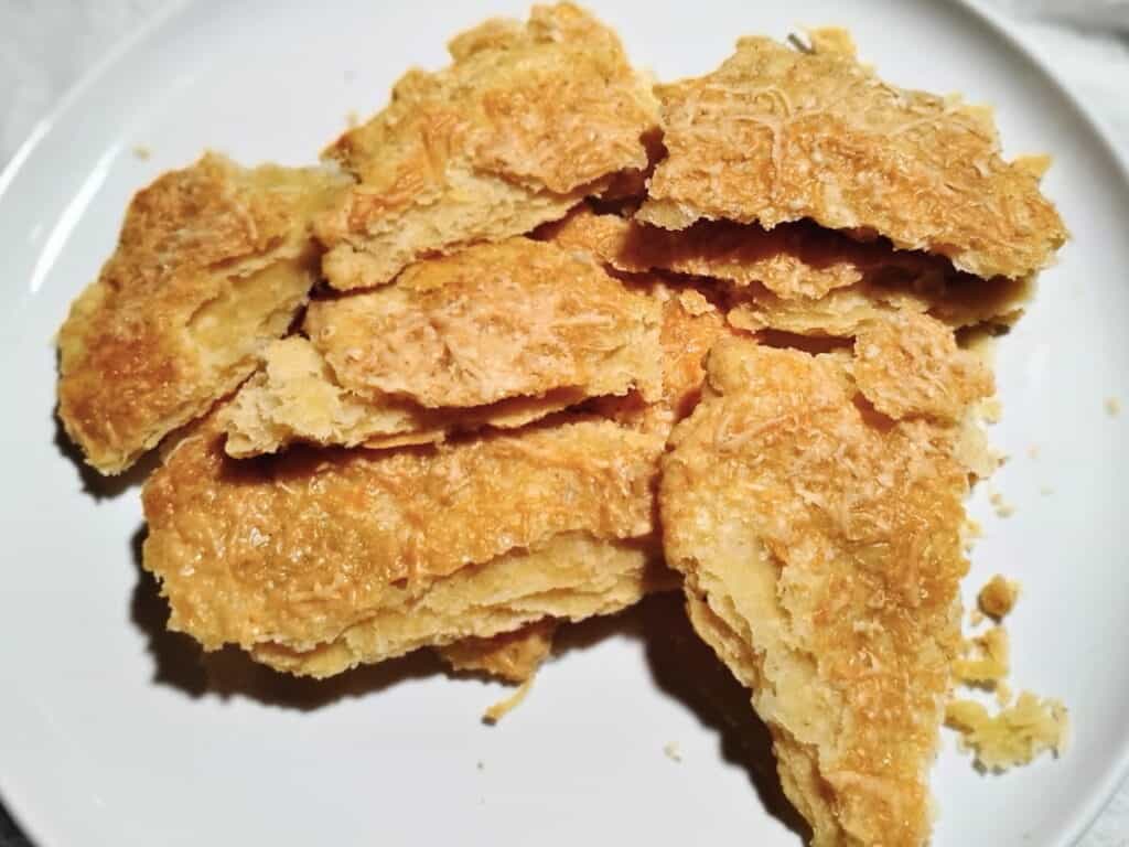 a plate with a pile of flaky pie crust shards 