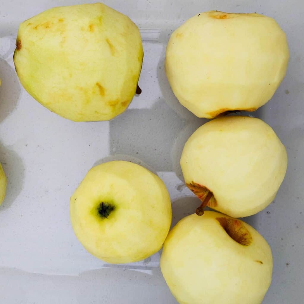 peeled apples in a bowl.