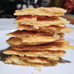 tall stack of flaky pie crust shards.