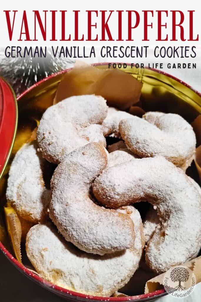 vanillekipferl in a cookie tin with a lid leaning on it and a decorative christmas tree behind it. text overlay reads vanillekipferl, German vanilla crescent cookies. food for life garden. 
