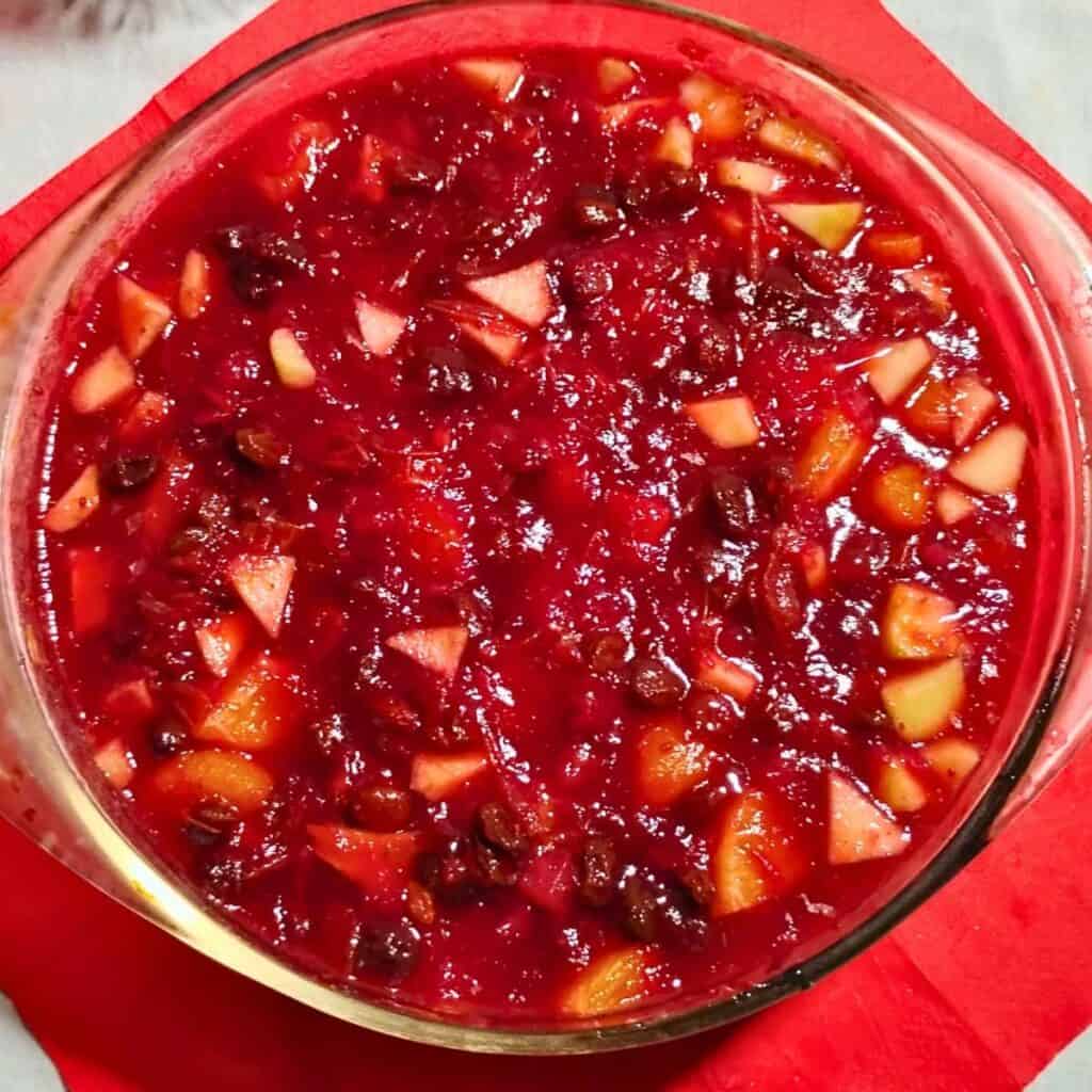 A bowl filled with cranberry orange jelled salad