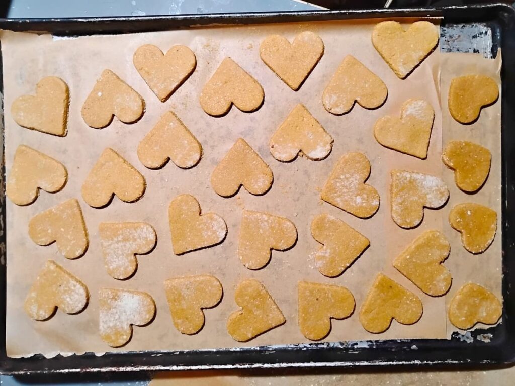 Zitronenherzen on a cookie sheet waiting to get baked. 