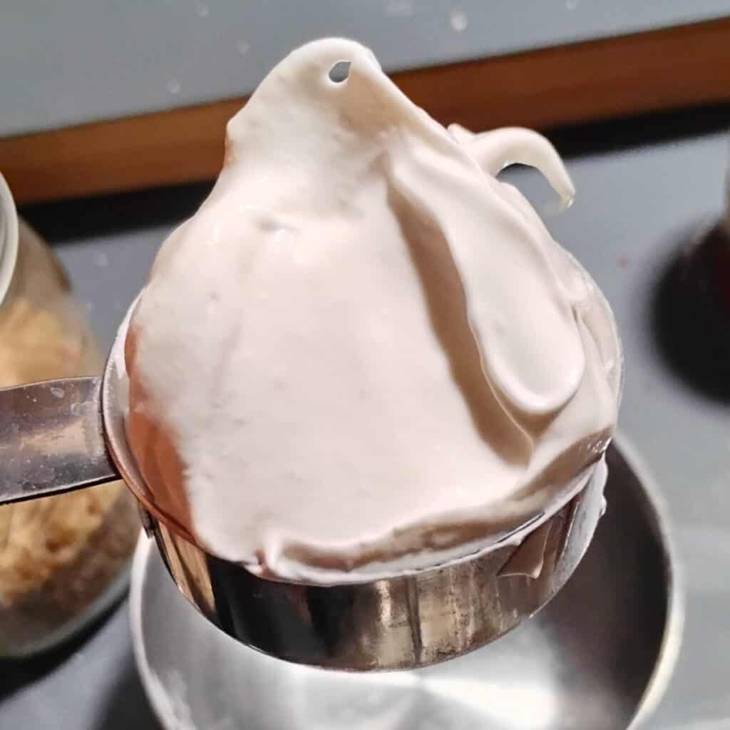 a half cup full of meringue batter to put aside for frosting the zimtsterne later.