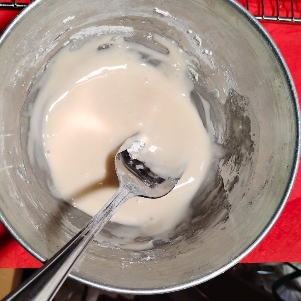 icing getting mixed in a bowl