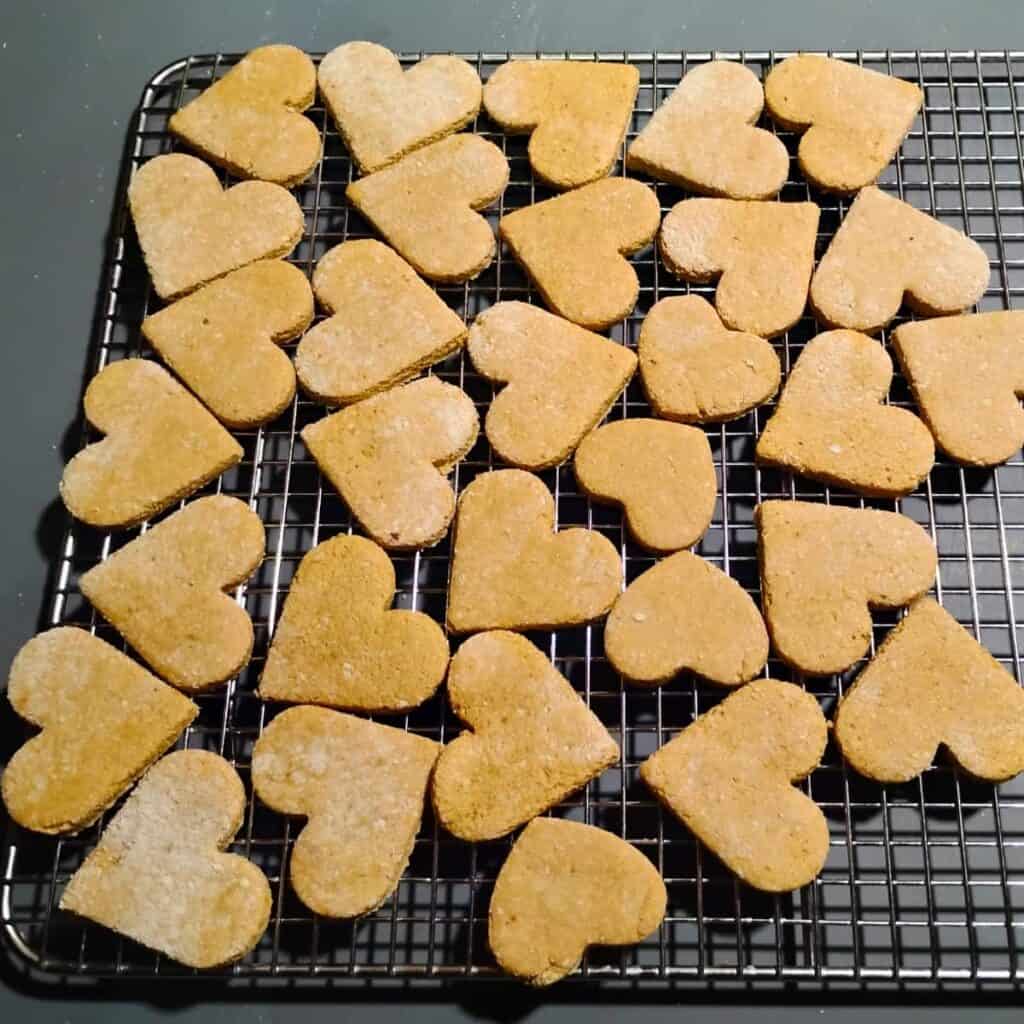 lemon heart cookies on a cooling rack ready to be iced.