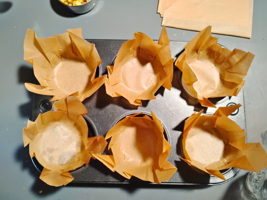 homemade muffin liners in a muffin pan.