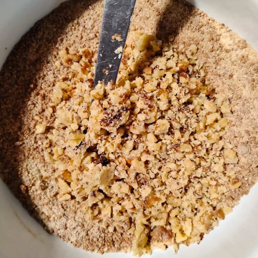 flour and chopped nuts in a bowl.