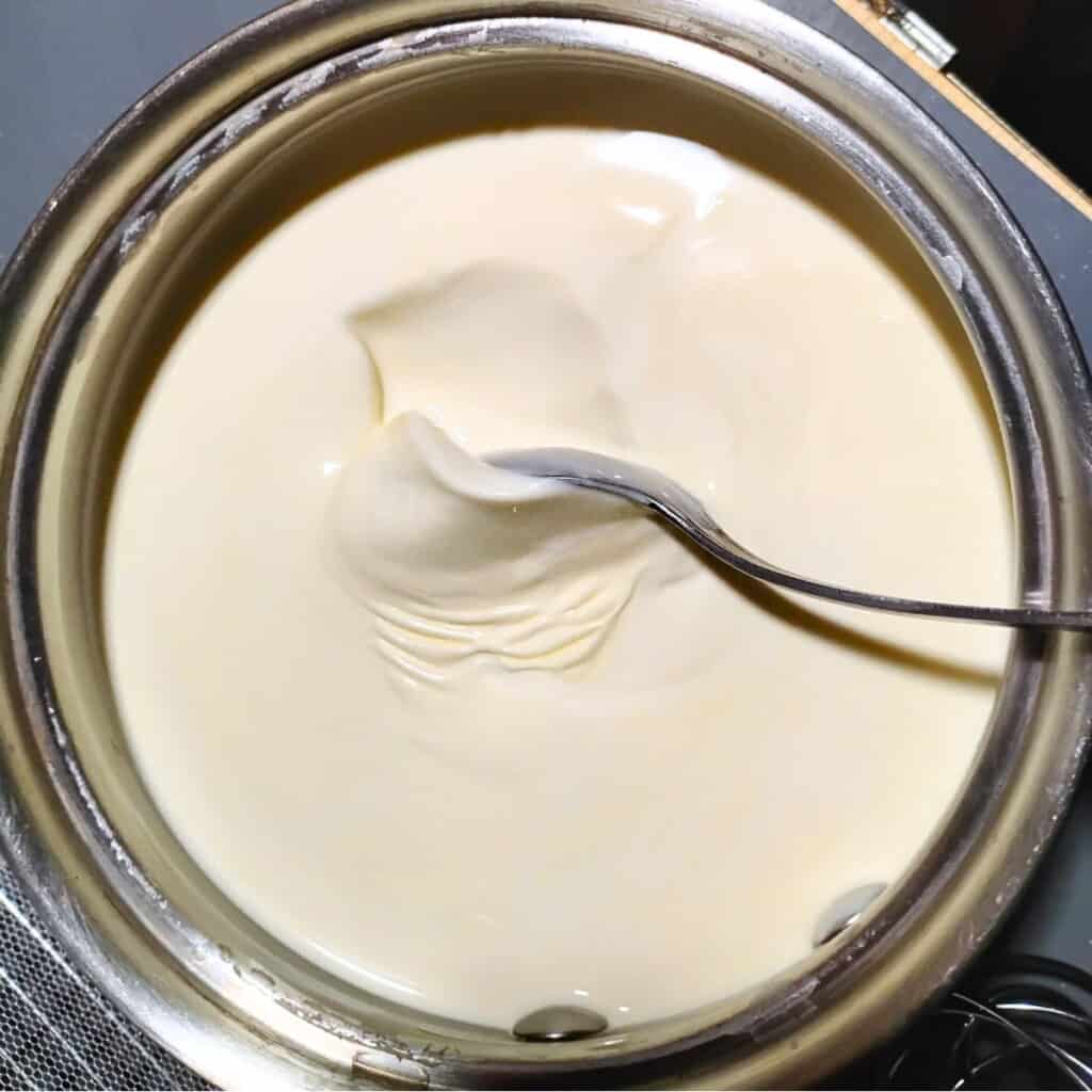 Thick, cultured cream in a sauce pot.