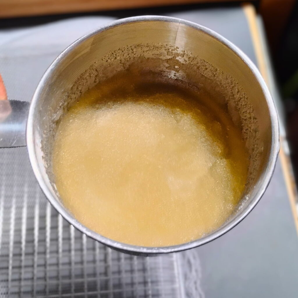 photo shows a measuring cup with some blooming gelatin.