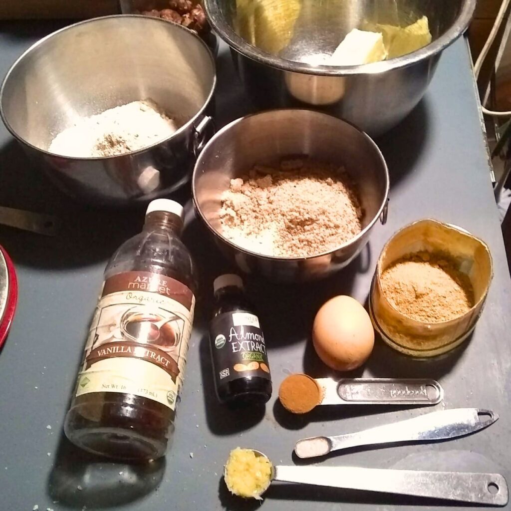 ingredients to make linzer cookies are layed out on a table.