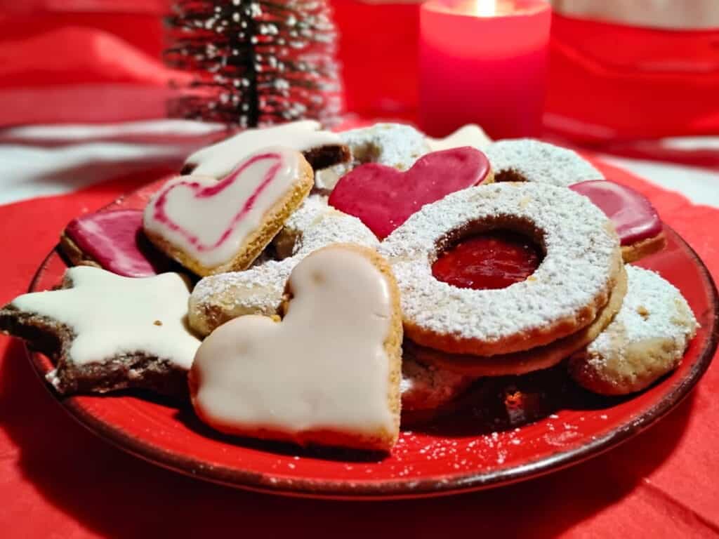 plate loaded with an assortment of German Christmas cookies