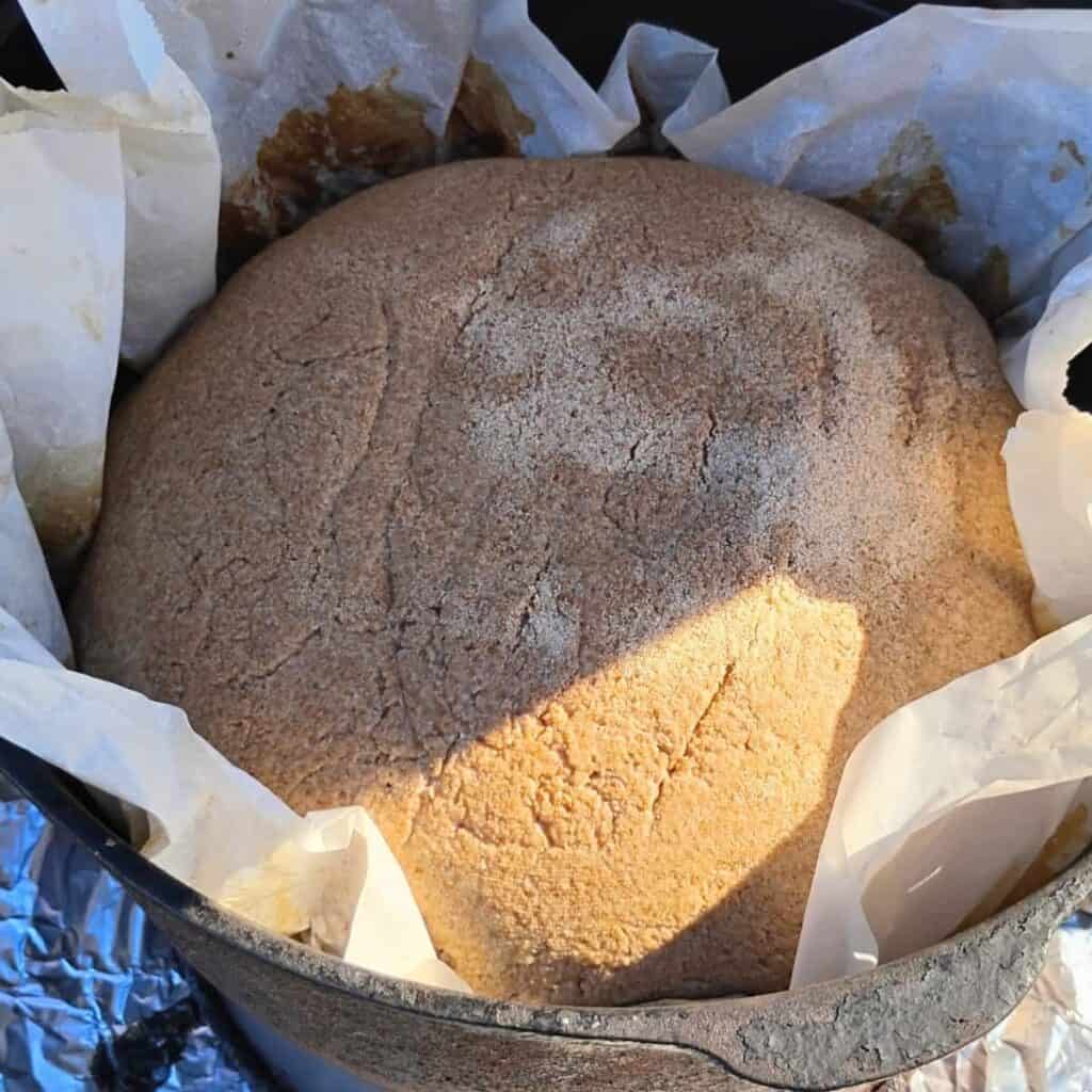 kamut and rye sourdough bread loaf in a dutch oven ready for baking.