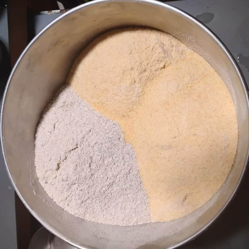 a bowl filled with rye and kamut flour. 