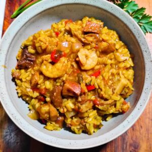 a bowl filled with shrimp and ham jambalaya