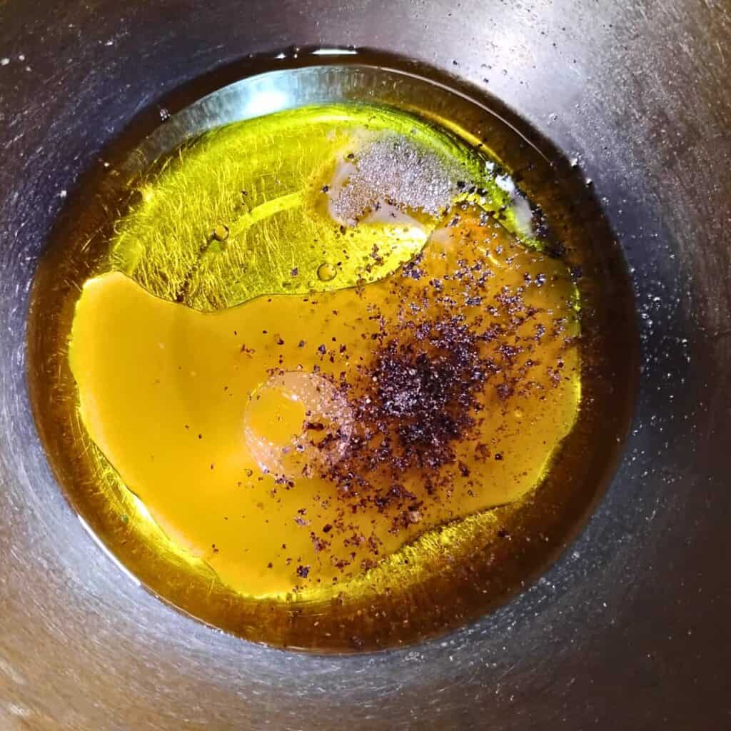 lemon juice, extra virgin olive oil, pepper, salt, and coriander in a bowl. 